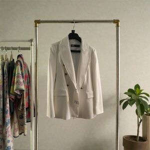 Double breasted white blazer